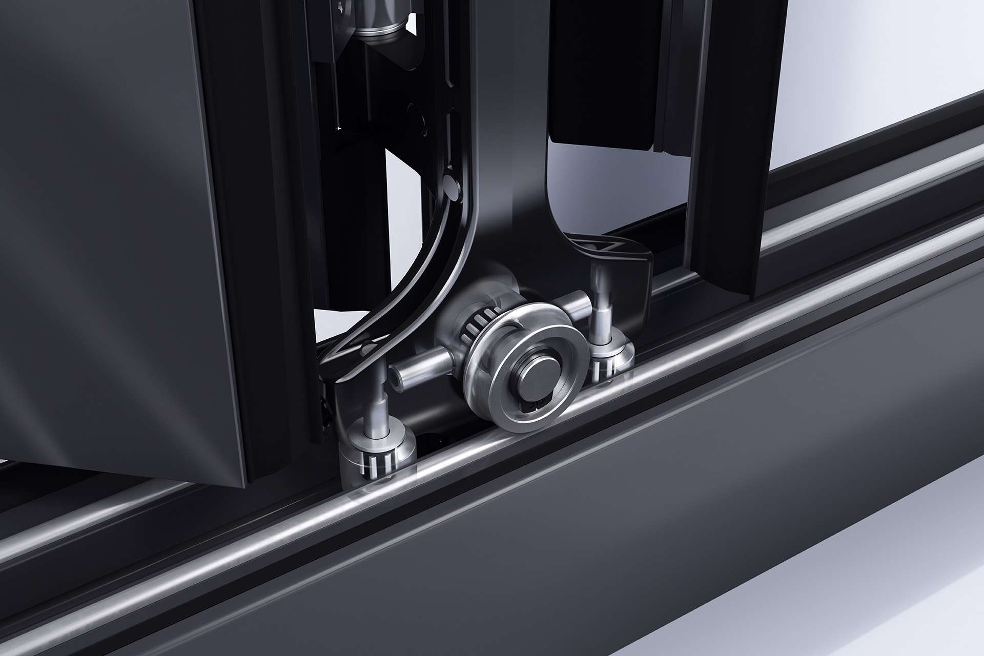 A full close up of the Korniche bi-folding door rollers sitting on the track showing the detail of the mechanism.