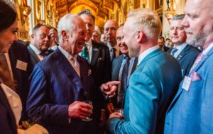 Managing Director Bradley Gaunt shares a laugh with King Charles during the reception for the King's Award For Enterprise.