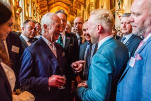 Managing Director Bradley Gaunt shares a laugh with King Charles during the reception for the King's Award For Enterprise.