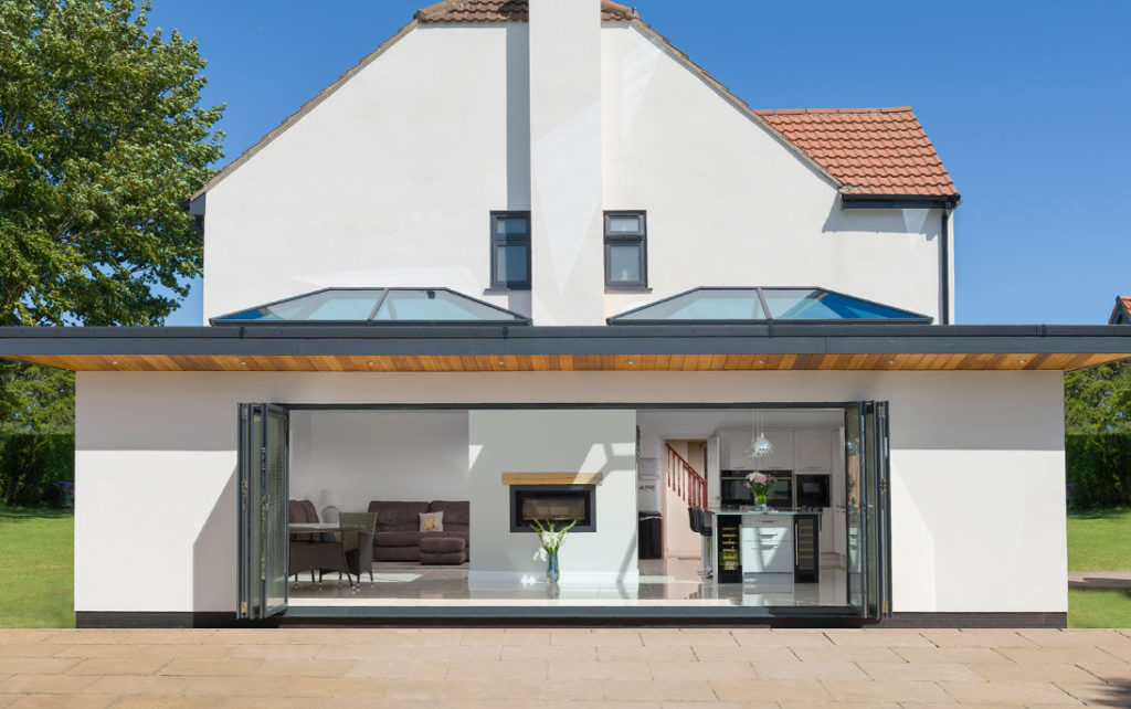 Korniche products showcased in house; a bi-folding door fully open with 2 Sky Lanterns on extension roof