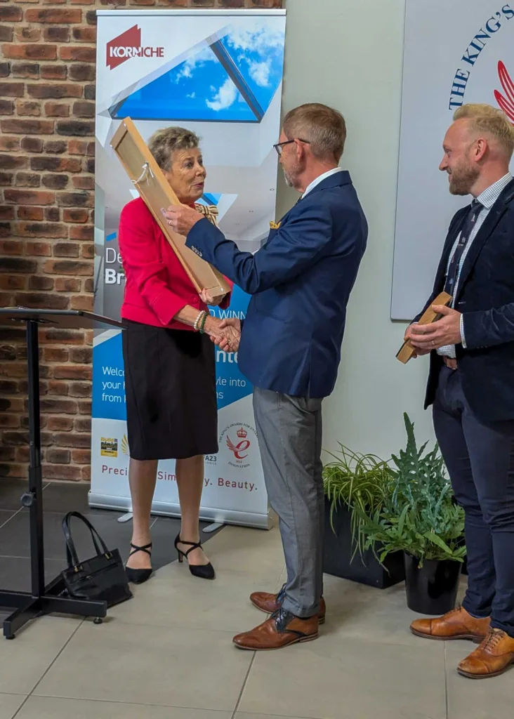 Richard Gaunt, Founder of Made For Trade, shaking hands with His Majesty's Lord Lieutenant of County Durham, Mrs Sue Snowdon, as she presents him with a framed scroll from King Charles III.