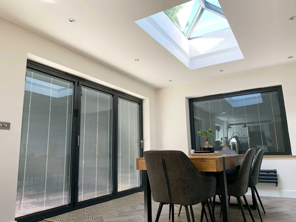 Dining Room with 3-Pane Korniche Bifolding Door and Integral Blinds